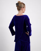 Emma Boat Neck Leaf Back Top shown from behind in luxurious cobalt blue velvet, featuring distinctive overlapping leaf design on back, three-quarter length sleeves with split cuffs, against light background. Elegant upswept hairstyle completes the sophisticated silhouette.