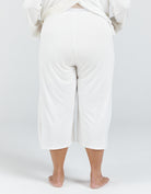 Essensual PJ Set in crisp white, featuring comfortable cropped wide-leg pants with elastic waistband, shown from back view against light background, perfect for easy nighttime wear and unrestricted movement during sleep.