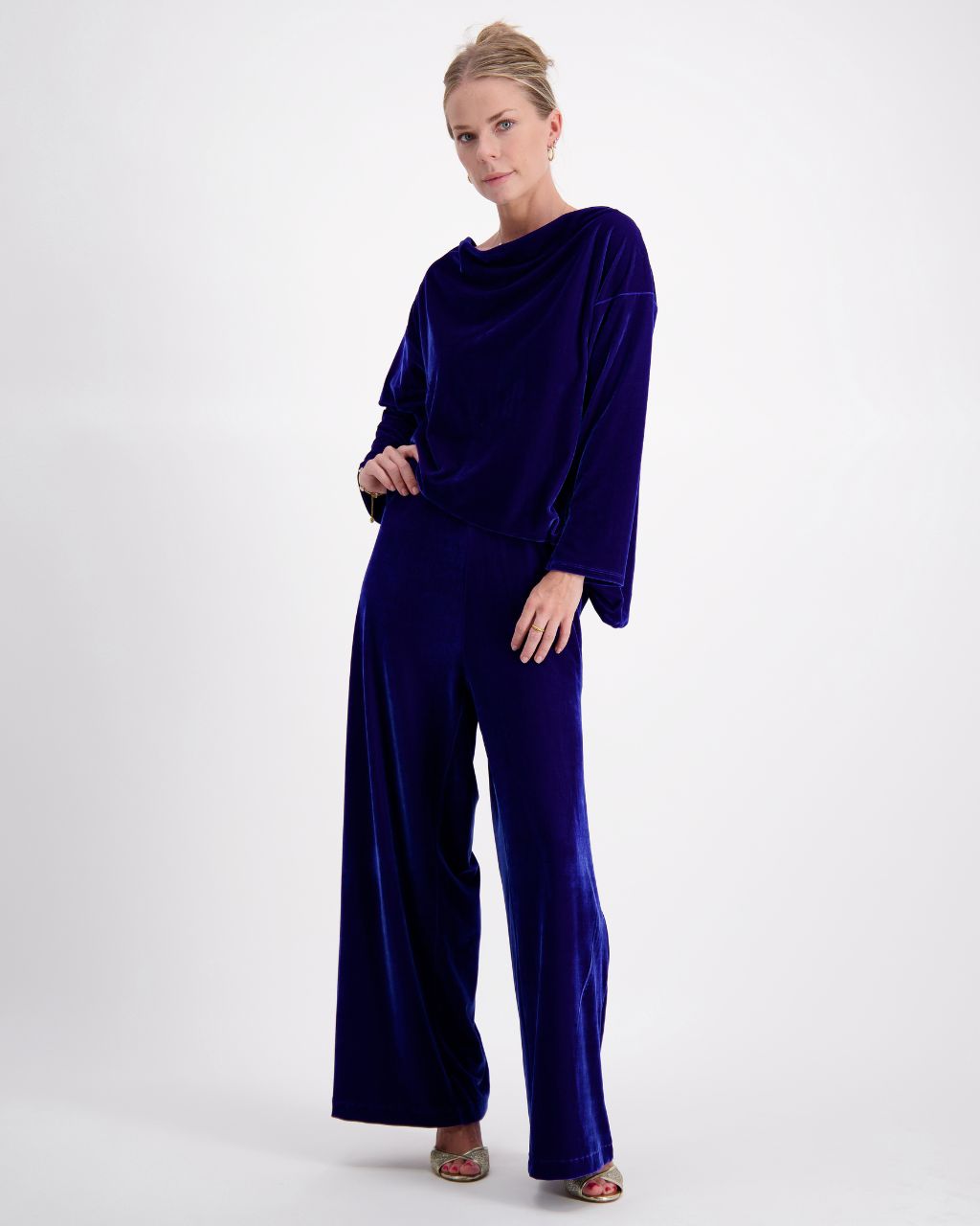 Emma Boat Neck Leaf Back Top in luxurious cobalt blue velvet, featuring elegant wide-leg pants, boat neckline, and three-quarter length sleeves. Showcased in a sophisticated full-length pose against a light background, highlighting the plush texture and flowing silhouette.