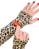 Maggie Thermal Top sleeve detail showing leopard print pattern with an adjustable red strap feature, demonstrated on a hand wearing red nail polish. The thermal material features classic tan and black spots on a cream background.