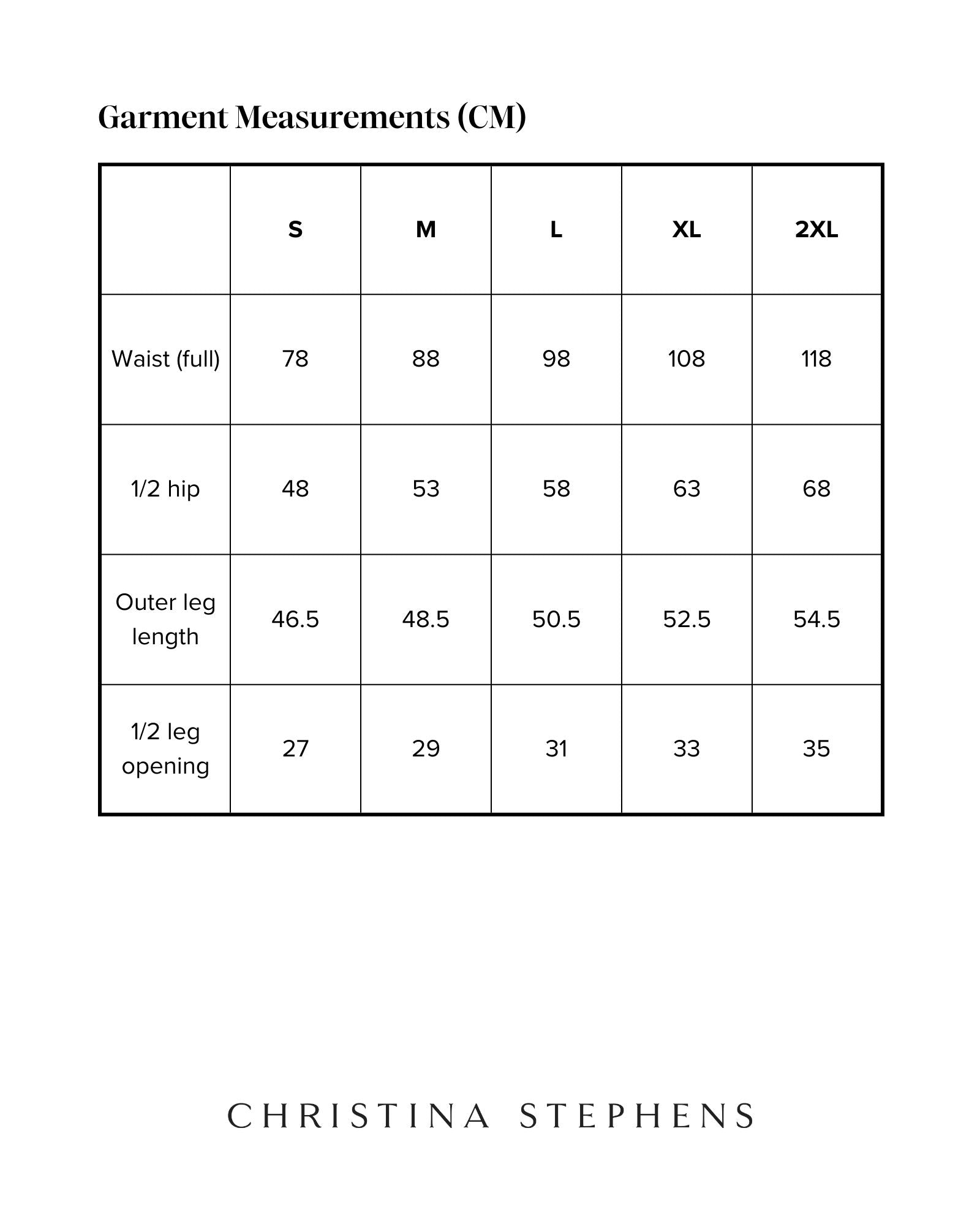 Size chart for Lindsay Seated Board Shorts displaying measurements in centimeters. Table shows waist, hip, outer leg length, and leg opening measurements for sizes S through 2XL, with Christina Stephens branding below.