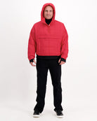 The Elly Universal Puffer Jacket shown in vibrant red with a hoodie design, featuring a pullover style with front pocket. The adaptive jacket is displayed against a white background, demonstrating its quilted pattern and relaxed fit design perfect for wheelchair users.