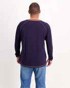 Sir Lord Raglan T-Shirt shown from back view in navy blue with brown contrast stitching and raglan sleeves, paired with light wash jeans against white background, demonstrating classic A-line silhouette and casual styling versatility