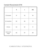 Size chart for Matt Gender Neutral Puffer Vest displaying measurements in centimeters across three sizes: S, L, and 2XL. Shows half shoulder, chest/bust, hem, and center front length measurements in a clean, minimalist table format.