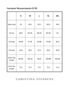 Size chart for Tapered Track Pants with Adjustable Cuff showing detailed measurements in centimeters for sizes S to 2XL, including waist, hip, thigh, knee, and leg length measurements in a clear grid format with brand name Christina Stephens below