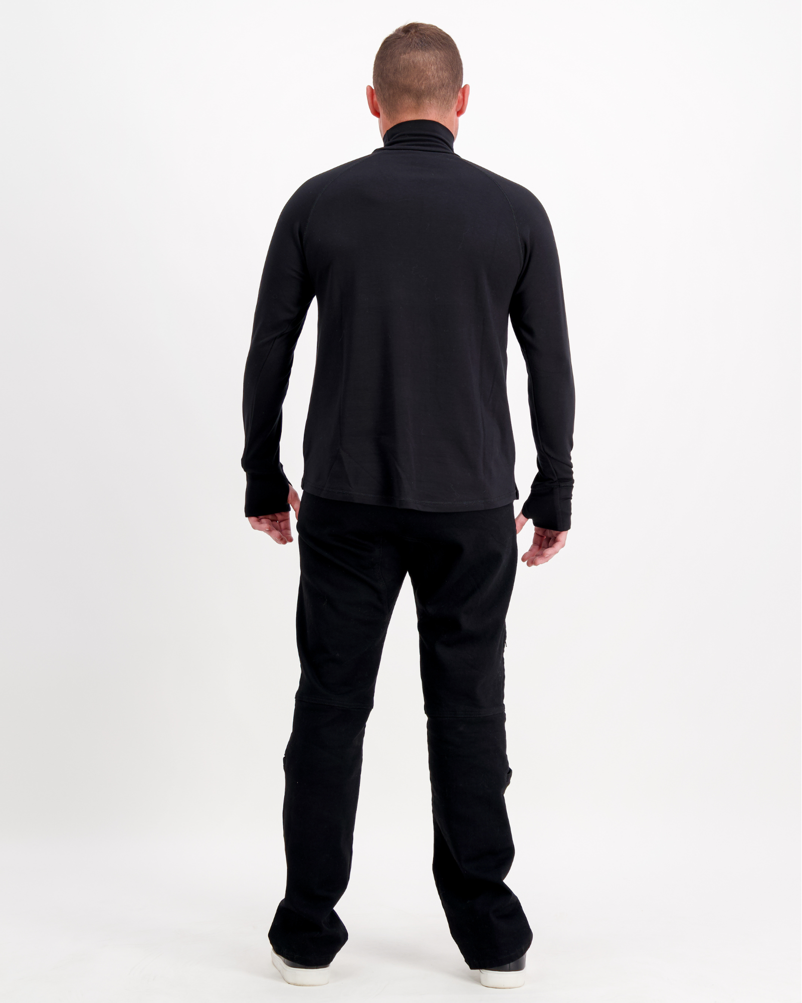 Back view of the Louis Thermal Top in classic black, showing sleek turtleneck design and comfortable fit from shoulders to waist, paired with black pants against white background, demonstrating versatile casual style