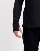 Louis Thermal Top shown with extended sleeves featuring thumb holes for added warmth and comfort. Close-up view of the black thermal top's sleeve detail, demonstrating the adaptive design suitable for both seated and standing wear.