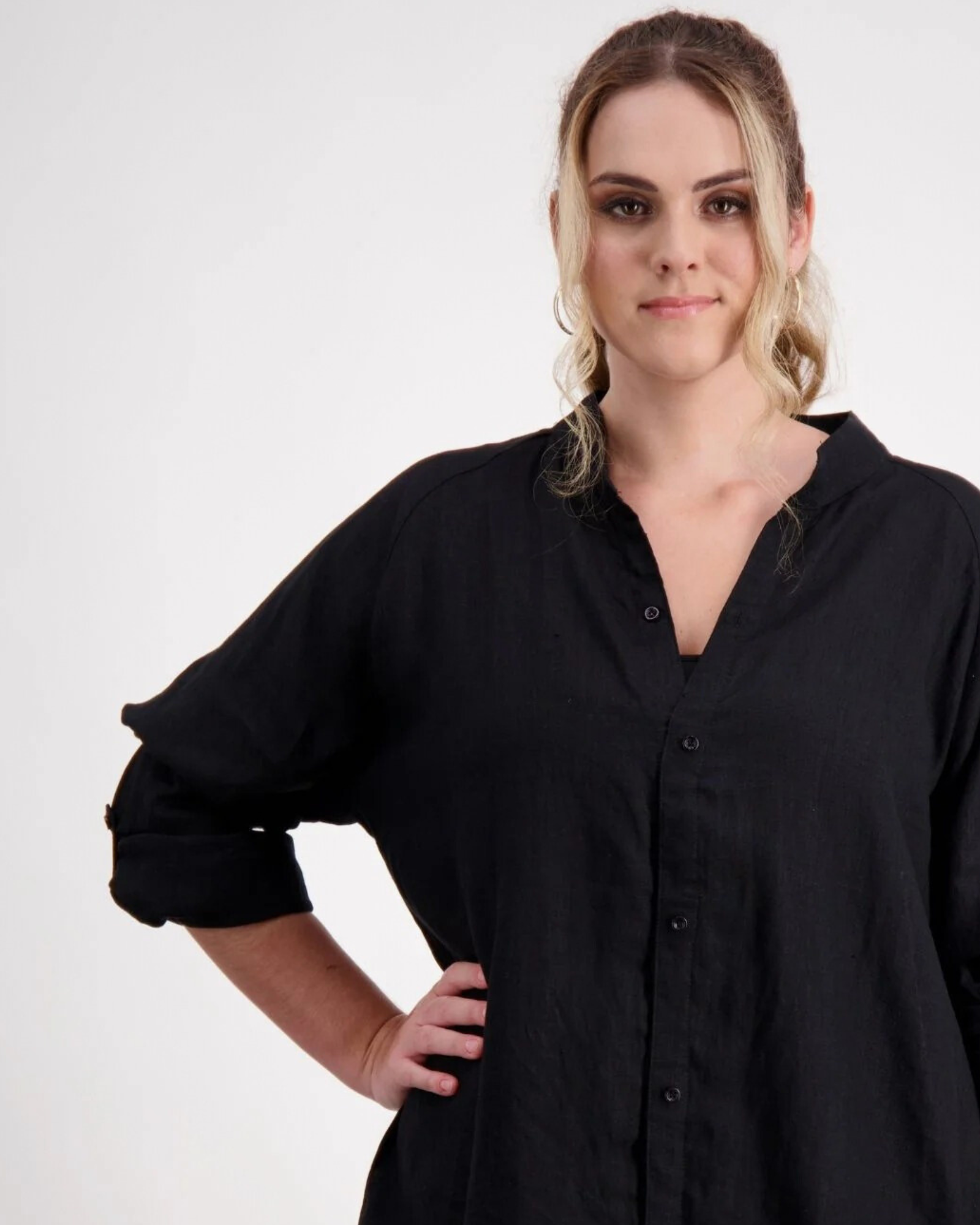 Cruiser Magnetic Linen Shirt shown in classic black, featuring a relaxed fit design with rolled-up sleeves. The adaptive clothing piece displays magnetic closures and a comfortable v-neck collar against a white background, highlighting its gender-neutral smart-casual styling.