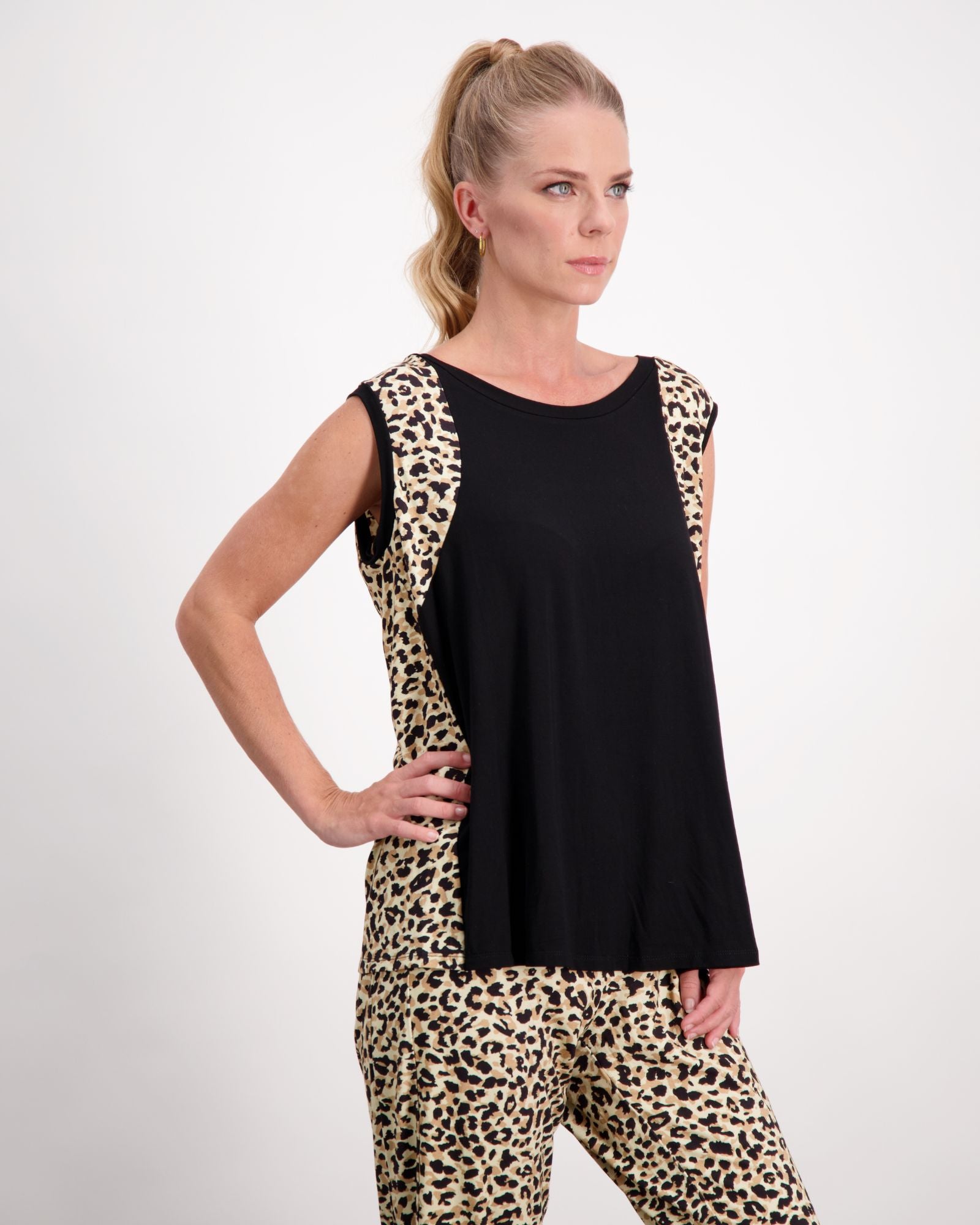 Lauren Sleeveless Physio Top in black with leopard print side panels, showcasing a stylish activewear design perfect for exercise and casual wear. Standing pose against white background displaying the sleeveless cut and flattering fit.